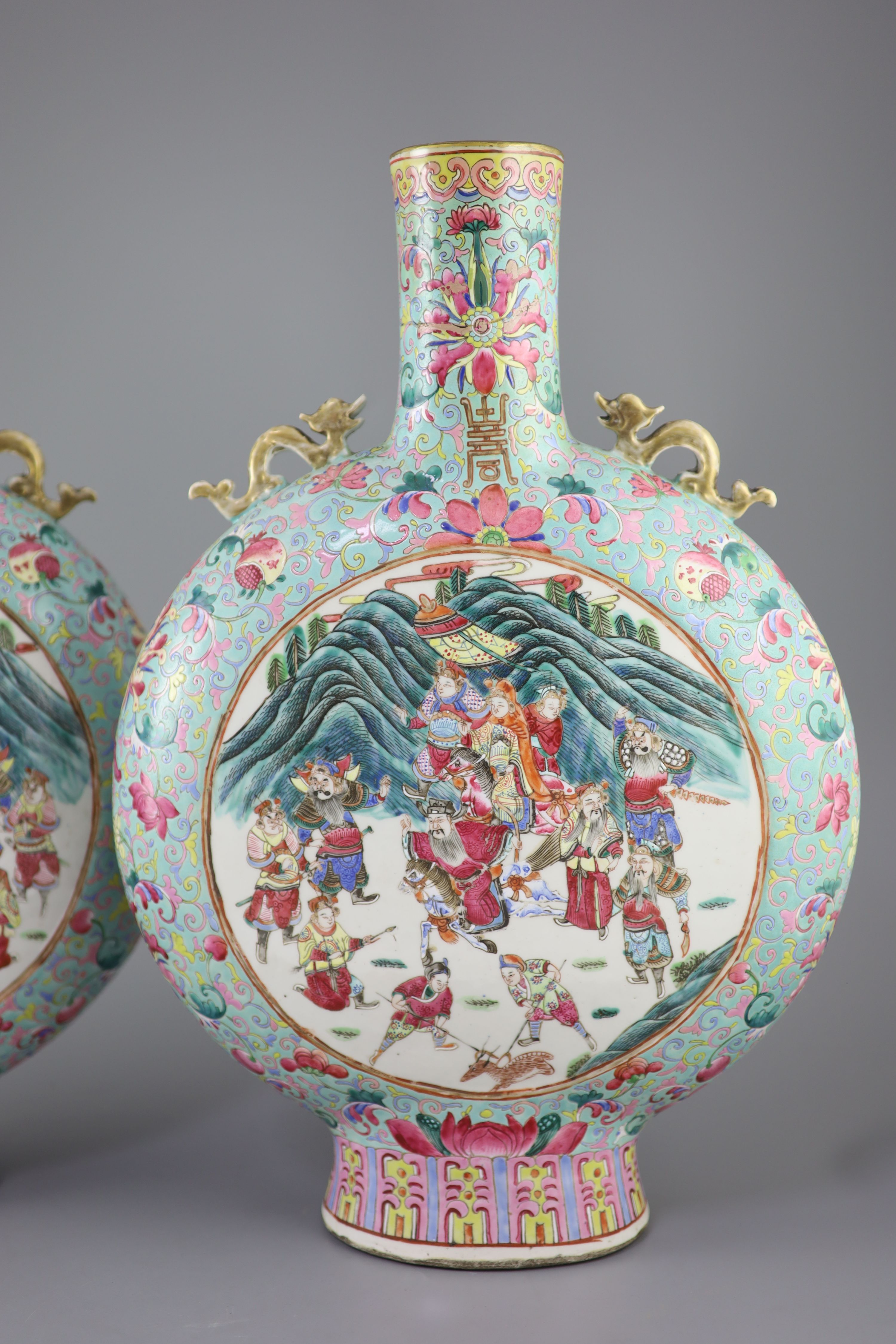 A pair of large Chinese turquoise ground famille rose moon flasks, Tongzhi seal mark and of the period (1862-74), 51cm high, Provenance